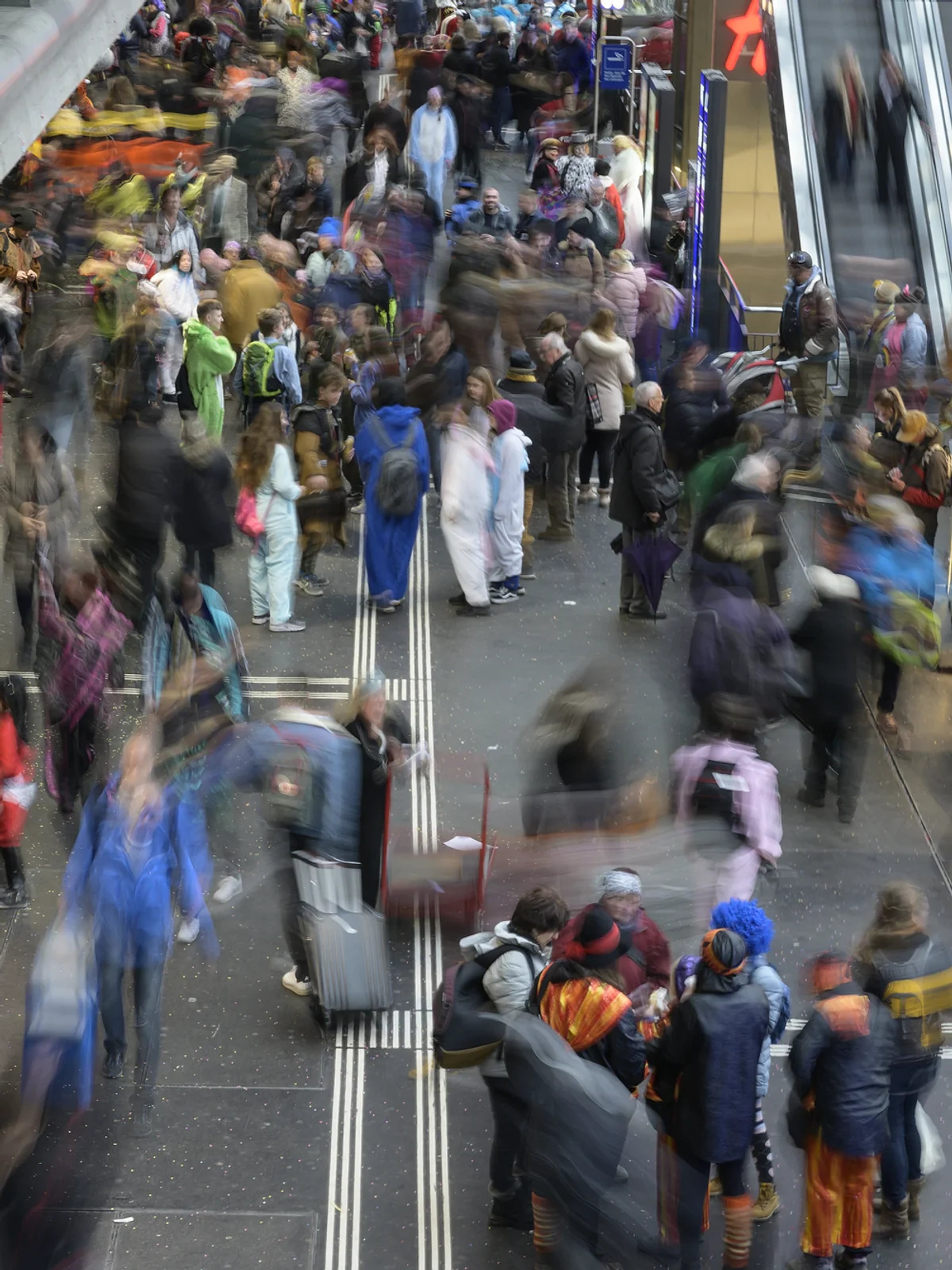 Visitors moving through a busy transport hub