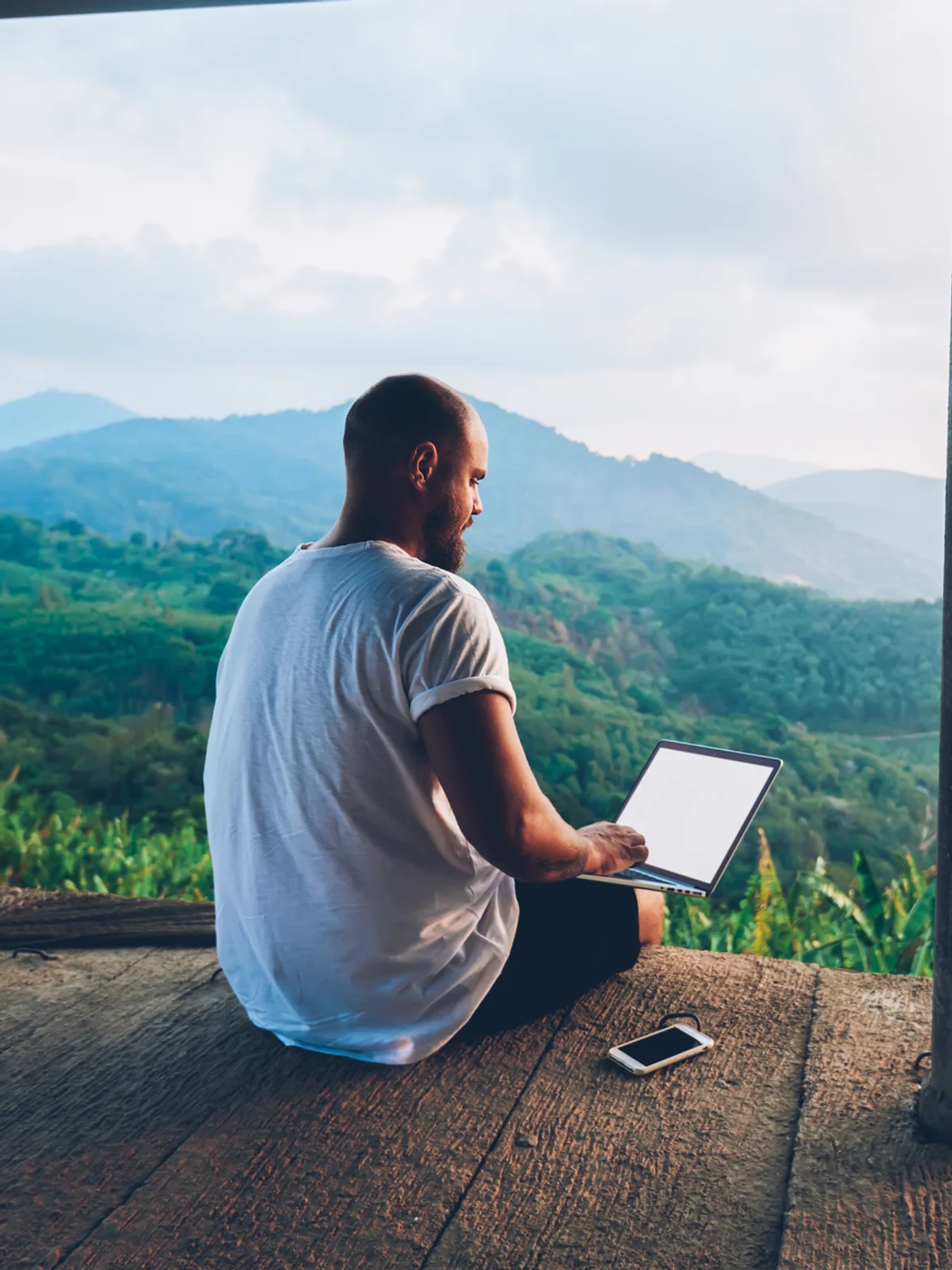 A traveller using a digital platform in the mountains